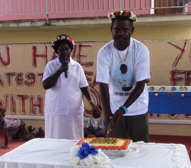 Fr. Benedict Qelo cuts the ist Anniversary cake